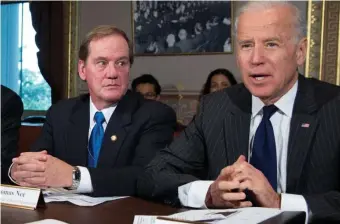  ?? AP FILE ?? THAT WAS THEN: Thomas Nee sits with then-Vice President Joe Biden during a December 2012 meeting in Washington.