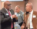  ?? CHRIS LANDSBERGE­R/THE OKLAHOMAN ?? Gerald Scott and Garland Pruitt talk during the OK Justice Circle’s Breaking Bread Breakfast on Thursday in south Oklahoma City.