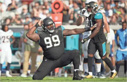  ?? LOGAN BOWLES/GETTY IMAGES ?? The Jaguars’ Marcell Dareus celebrates a play vs. the Chargers on Sunday.