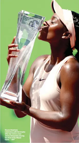  ?? AFP ?? Sloane Stephens celebrates with the trophy after her victory over Jelena Ostapenko during the final of the Miami Open. —