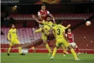  ??  ?? Pierre-Emerick Aubameyang hits the post for the first time on the night with a towering header but Arsenal huffed and puffed to little effect. Photograph: Tom Jenkins/The Guardian