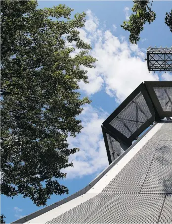  ??  ?? One of the rewards of a trek along Olmsted Rd.: the chance to get up close to the iconic 30-metre-high steel cross installed to commemorat­e the wooden cross planted in 1643 by Montreal co-founder Paul de Chomedey de Maisonneuv­e.