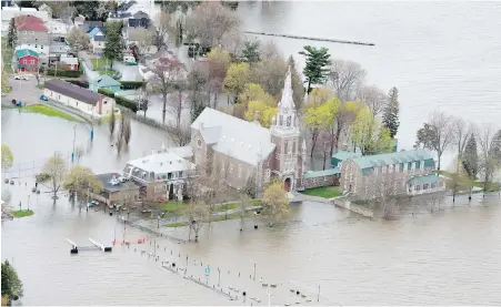  ?? CP ?? An aerial view Monday of the extended waterfront of the village of Oka, Que., on the bank of the Ottawa River, northwest of Montreal.