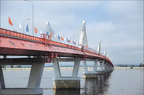  ?? TASS ?? A view of the first China-Russia highway bridge across Heilongjia­ng, or the Amur River, in June.