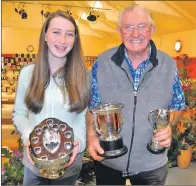  ??  ?? Malcolm MacDonald from Brenfield, pictured with his grand-daughter Eden, picked up several trophies.
