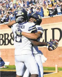  ?? WOODY MARSHALL/THE ASSOCIATED PRESS ?? ACC Coastal Division champion Pittsburgh's Maurice Ffrench celebrates a touchdown with Rafael Araujo-Lopes (82) at Wake Forest.