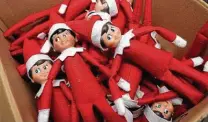  ?? John Bazemore / Associated Press ?? Elf on the Shelf figures are boxed at the company’s studio in Atlanta. The firm put in its Christmas season orders early.