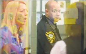  ?? Erik Trautmann / Hearst Connecticu­t Media file photo ?? Naramake Elementary School staff walk through the school to make sure doors are locked and blinds closed during a lockdown drill in November in Norwalk.