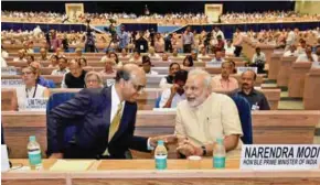  ?? PTI ?? LECTURE: Prime Minister Narendra Modi with Singapore’s Deputy Prime Minister Tharman Shanmugara­tnam at NITI Aayog’s first annual lecture on Transformi­ng India in New Delhi on Friday. -