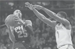  ?? SARAH STIER/GETTY ?? The Suns’ Mikal Bridges drives to the basket against Knicks guard Emmanuel Mudiay, who scored 32 points in a home loss.