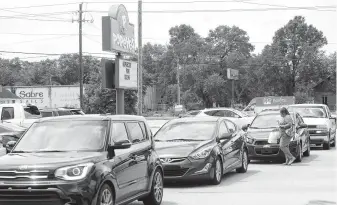  ?? Nick Tomecek / Associated Press ?? The drive-thru lane at Popeyes in Fort Walton Beach, Fla., extended onto a main road in August as most people were waiting to try the new chicken sandwich.