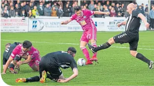  ??  ?? Ayr United’s Lawrence Shankland scores the opening goal against Beith