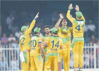  ??  ?? Pakhtoon’s players celebrate after winning the T10 League match against Maratha Arabians at the Sharjah Cricket Stadium on Wednesday.