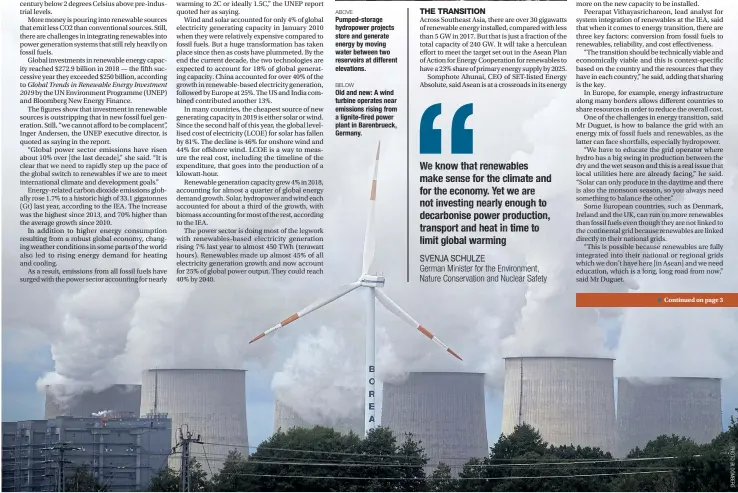  ??  ?? BELOW
Old and new: A wind turbineope­rates near emissions risingfrom a lignite-fired power plant in Barenbruec­k, Germany.