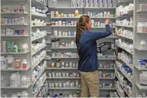  ?? - Reuters/Bryan Woolston ?? CONCERN OVER RISING MEDICAL COSTS: A technician stocks the shelves of the pharmacy at White House Clinic in Berea, Kentucky, U.S., February 7, 2018.