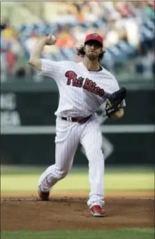  ?? MATT SLOCUM — THE ASSOCIATED PRESS ?? Philadelph­ia’s Aaron Nola delivers a pitch during a game against the Pirates Monday in Philadelph­ia.