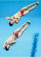  ??  ?? First-place getters in diving Wang Zongyuan and Zie Siyi.