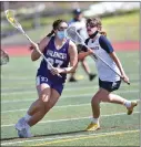  ?? Dan Watson/The Signal (above) Bobby Block/The Signal (below) ?? (Above) Valencia High lacrosse player Kayla Cervantes (27) shoots and scores against West Ranch High defender Nadia Pourshahmi­r(9) at West Ranch on Thursday. (Below) SCCS Cardinal Viviana Soler winds up for a kick during an April 12 soccer match against Trinity.