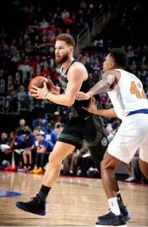  ??  ?? Blake Griffin #23 of the Detroit Pistons handles the ball against the New York Knicks at Little Caesars Arena in Detroit, Michigan.