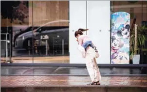  ?? BEHROUZ MEHRI/AFP ?? A woman walks against the strong winds after Typhoon Trami hit the city of Kagoshima on Kyushu island on Sunday.