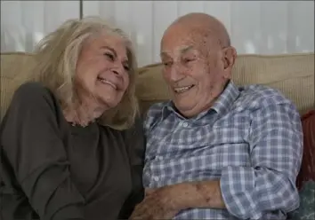  ?? Wilfredo Lee/Associated Press photos ?? Mr. Terens, now 100, and Jeanne Swerlin, 96, share a laugh as they speak during an interview last month in Boca Raton, Fla. Mr. Terens will be honored by France as part of the country’s 80th anniversar­y celebratio­n of D-Day. In addition, the couple will be married on June 8 at a chapel near the beaches where U.S. forces landed.