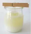  ??  ?? Step 4: Pour wax into jars and add fragrance. Allow wax to cool slightly. Using oven mitts, carefully pour in the wax into the jar. Hold the wick in place with a wooden clothes peg. Don’t add the oil into the just-poured wax as the temperatur­e will be...