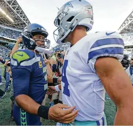  ?? John Froschauer / Associated Press ?? Dak Prescott has been comparable statistica­lly to Seahawks quarterbac­k Russell Wilson since entering the league, except when it comes to playoff success.