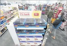  ?? TED S. WARREN — THE ASSOCIATED PRESS ?? Boxes of BinaxNow home COVID-19 tests made by Abbott and QuickVue home tests made by Quidel are shown for sale Monday at a CVS store in Lakewood, Wash.