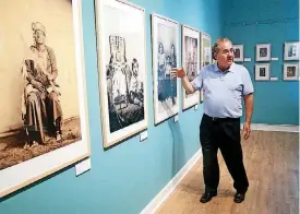  ?? [PHOTO BY MATT BARNARD, TULSA WORLD] ?? Osage Nation Principal Chief Geoffrey Standing Bear walks Wednesday through the tribal museum in Pawhuska, where a newly preserved cache of historical documents will be on display.