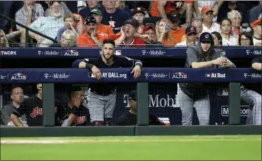  ?? DAVID J. PHILLIP — THE ASSOCIATED PRESS ?? Indians players watch from the dugout as they fall to the Astros in Game 2 of a American League Division Series game Oct. 6 in Houston.