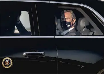  ?? Gina Ferazzi Los Angeles Times ?? GOV. GAVIN NEWSOM joins President Biden’s motorcade after an election eve rally in Long Beach. The governor’s political near-death experience could inspire him to make changes, or at least a show of gratitude.