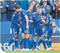  ??  ?? Jamie Vardy celebrates after scoring the third