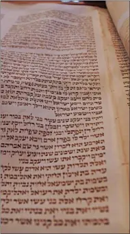  ?? FRANCINE D. GRINNELL - MEDIANEWS GROUP ?? Rabbi Motzkin:”Torah scrolls contains 60 to 80 separate panels stitched together and each one is a skin of a different animal.”
