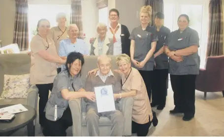  ??  ?? Staff and residents at Grampian Court in Peterlee celebrate the home’s success.
