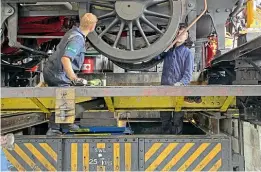  ?? ANDREW JEFFERY ?? Repairs to locos and carriages can rely on the services of both paid staff and volunteers. In the North Yorkshire Moors Railway workshop at Grosmont, ‘J27’ 0-6-0T No. 69023 Joem sits over the wheel drop and gets a leaf spring changed.