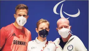  ?? Alex Davidson / Getty Images ?? Markus Rehm of Team Germany, Bebe Vio of Team Italy and Matt Stutzman of Team USA pose for a photo during a press conference ahead of the Tokyo 2020 Paralympic Games at Tokyo Big Sight on Sunday.