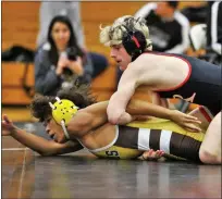  ?? ?? Romeo’s Owen Youngblood has control of Chad Crenshaw of Rochester Adams during their match at 120pounds during a Division 1regional final on Wednesday.