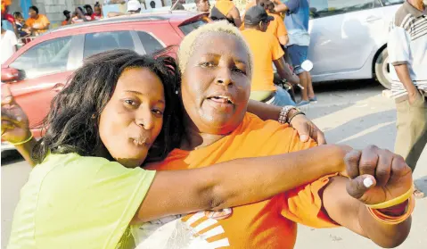  ?? FILE ?? In this November 2016 photo, supporters of JLP (left) and PNP are seen celebratin­g during the local government election.