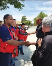  ?? Photo courtesy of Gabriela Garcia ?? Volunteers from the congregati­on of the World Mission Society Church of God in Santa Clarita meets with Ridgecrest Mayor Peggy Breedan, right, on Sunday. Breedan met Gov. Gavin Newsom on Saturday after he announced a state of emergency.