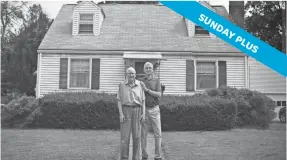  ?? JESSICA HILL/AP ?? Fred Ware, left, stands outside his home with his son Dave Ware in Manchester, Conn. They recently found a whites-only covenant on the property dating back to 1942 when researchin­g the title chain.