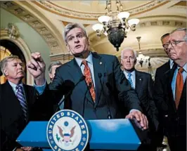  ?? ALEX BRANDON/AP ?? Sen. Bill Cassidy, center, suggested Sunday that he may adjust the health care bill, which he co-sponsored. On Sunday, several key GOP senators expressed doubts about the bill.