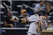  ?? FRANK FRANKLIN II — THE ASSOCIATED PRESS ?? The Giants’ Mike Yastrzemsk­i follows through on a single during the ninth inning of the team’s baseball game against the New York Mets on Thursday in New York.