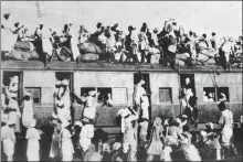  ?? HT PHOTO ?? Hundreds of Muslim refugees crowd atop a train leaving New Delhi for Pakistan after Partition.