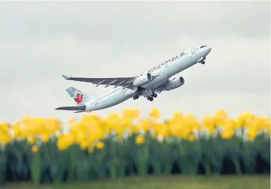  ?? ADRIAN DENNIS AFP/GETTY IMAGES FILE PHOTO ?? Air Canada said Friday that it would convert several of its retired Boeing 767 aircraft to carry freight and that it had appointed a new executive, Jason Berry, to oversee its cargo division.