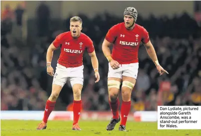  ??  ?? Dan Lydiate, pictured alongside Gareth Anscombe, was a stand-out performer for Wales.