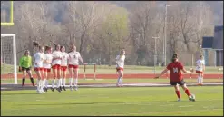  ?? Daniel Bereznicki/McDonald County Press ?? Anna Clarkson (No. 14) attempted to score a penalty kick against New Covenant Academy but overshot her kick and missed the point.