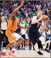  ?? ?? Phoenix Suns center Bismack Biyombo (left), defends as Dallas Mavericks guard Luka Doncic (77) drives to the basket in the second half of Game 4 of an NBA basketball second-round playoff series in Dallas. (AP)
