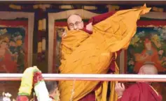  ??  ?? TAWANG TOWN: Exiled Tibetan spiritual leader the Dalai Lama adjusts his shawl as he came to deliver his religious teaching at Yiga Choezin ground at in Tawang District near India-china border in India’s north-eastern state of Arunachal Pradesh state...