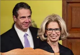  ?? Skip Dickstein / Times Union archive ?? New York Chief Judge Janet Difiore and her relatives were among those who received priority COVID-19 testing last year. She’s accompanie­d by Gov. Andrew M. Cuomo before her February 2016 swearing-in ceremony.