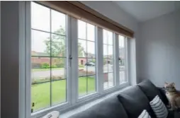  ??  ?? Above: White PVCU windows offer a clean and neutral look for your interiors, as these Residence Collection R7 double glazed windows in chalk white demonstrat­e
